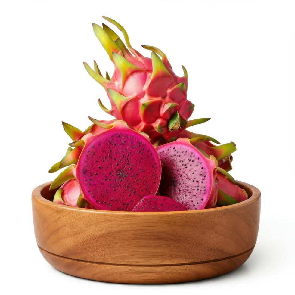 Tasty dragon fruit segments positioned skillfully in a wooden bowl on white ground photo