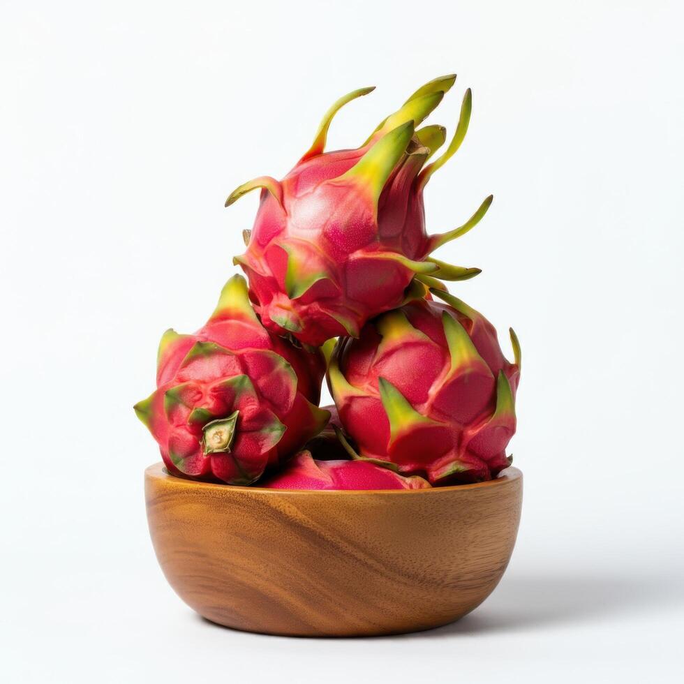 Colorful dragon fruit slices presented creatively in a wooden bowl on white base photo