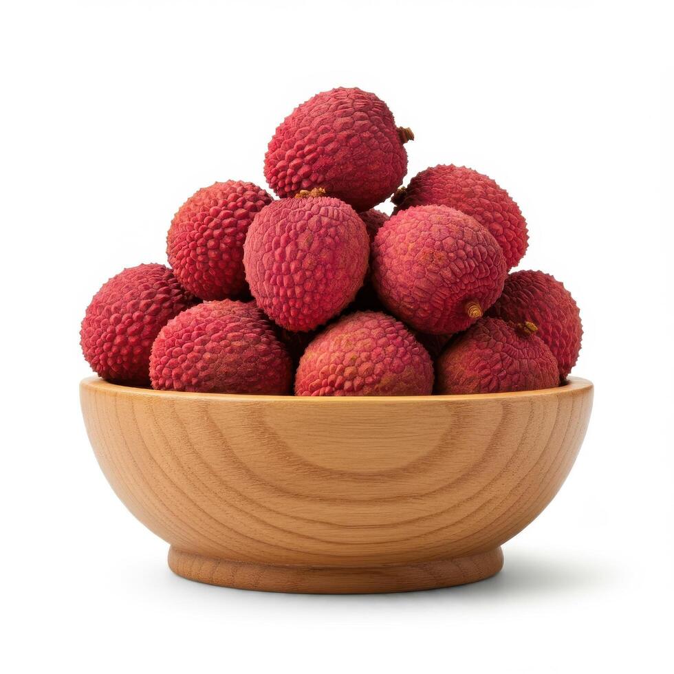 Whole fresh lychee spilling from a wooden bowl onto a white background, displaying its juiciness and texture photo