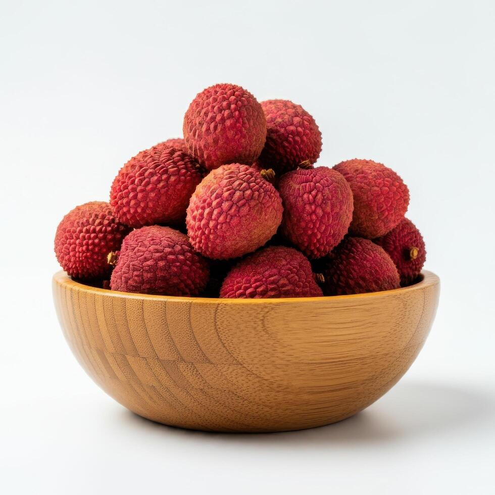 Whole fresh lychee spilling from a wooden bowl on a white background, highlighting its fresh appearance and vibrant color photo