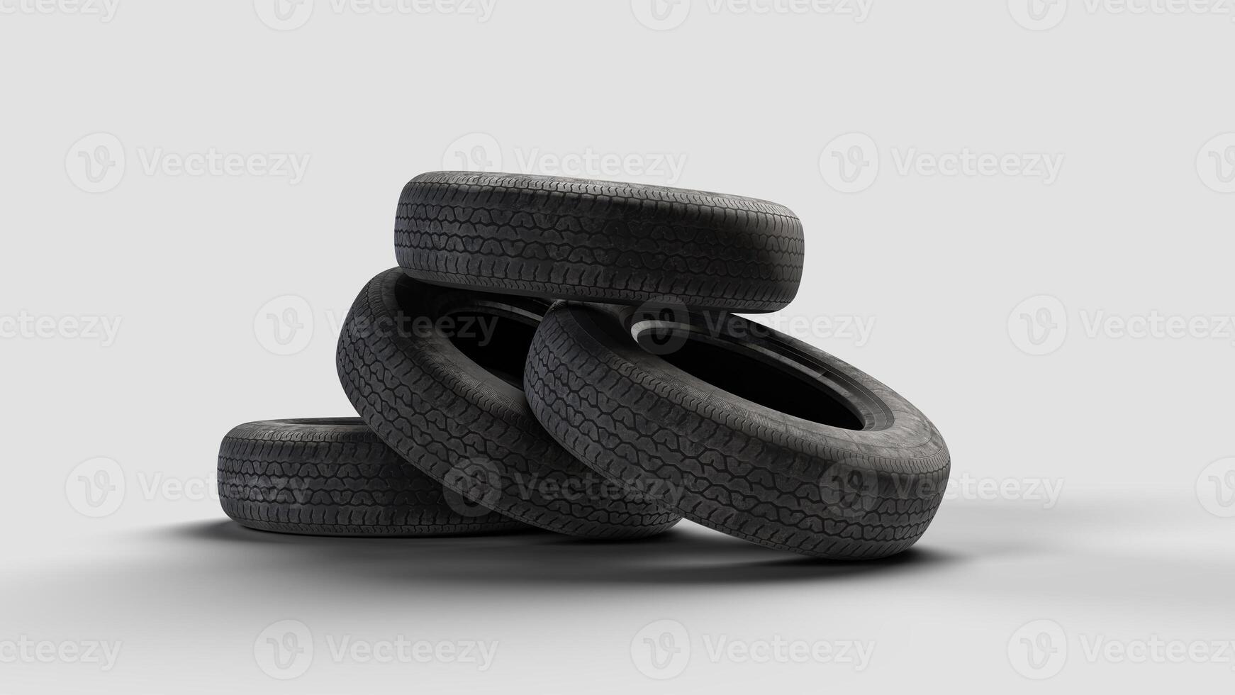 four old tires on a white background, view from below photo