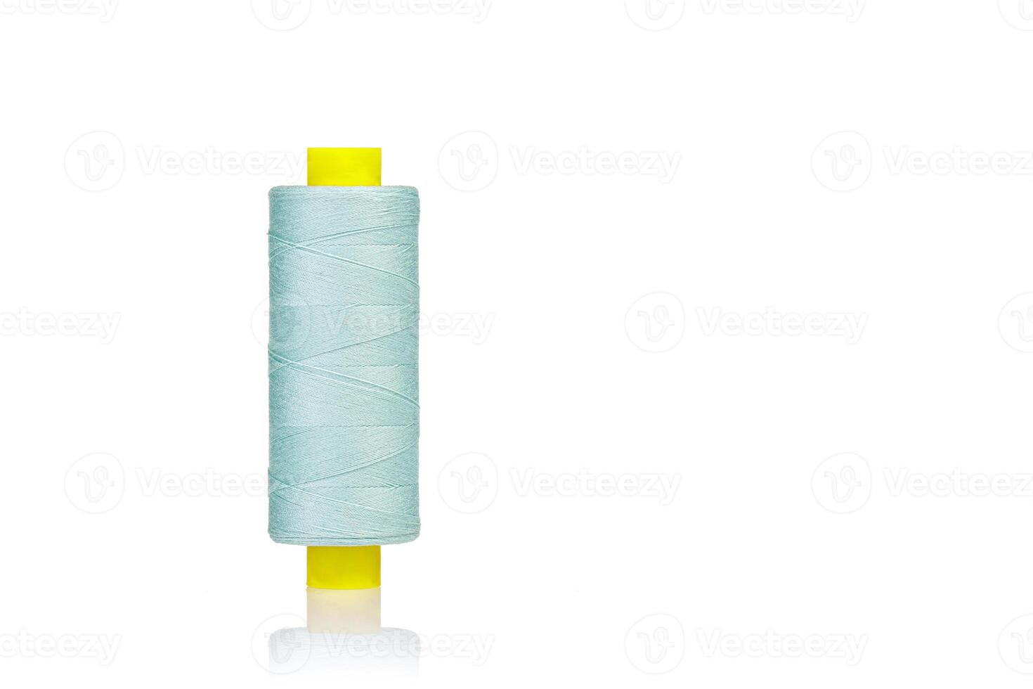 close up skein of thread green colors macro on a white background photo