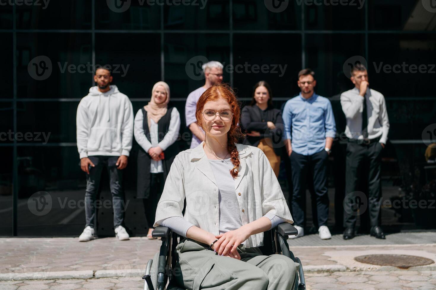 A diverse and confident group of businessmen posing together, with a businesswoman in a wheelchair radiating success, ambition, and unity, capturing the essence of a dynamic and inspiring business photo