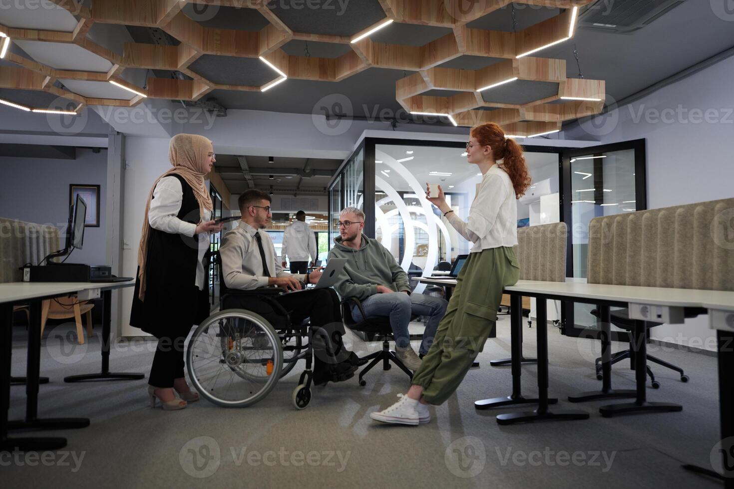 Young group of business people brainstorming together in a startup space, discussing business projects, investments, and solving challenges photo