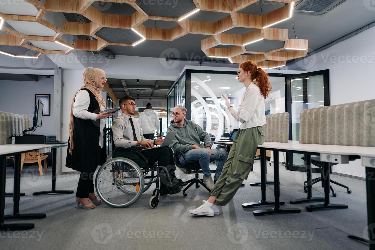 Young group of business people brainstorming together in a startup space, discussing business projects, investments, and solving challenges photo