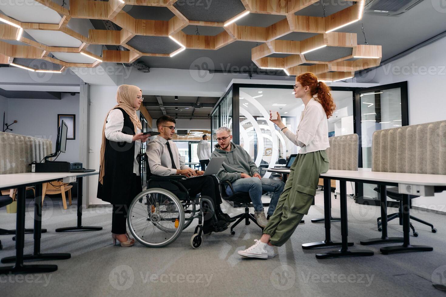 Young group of business people brainstorming together in a startup space, discussing business projects, investments, and solving challenges photo