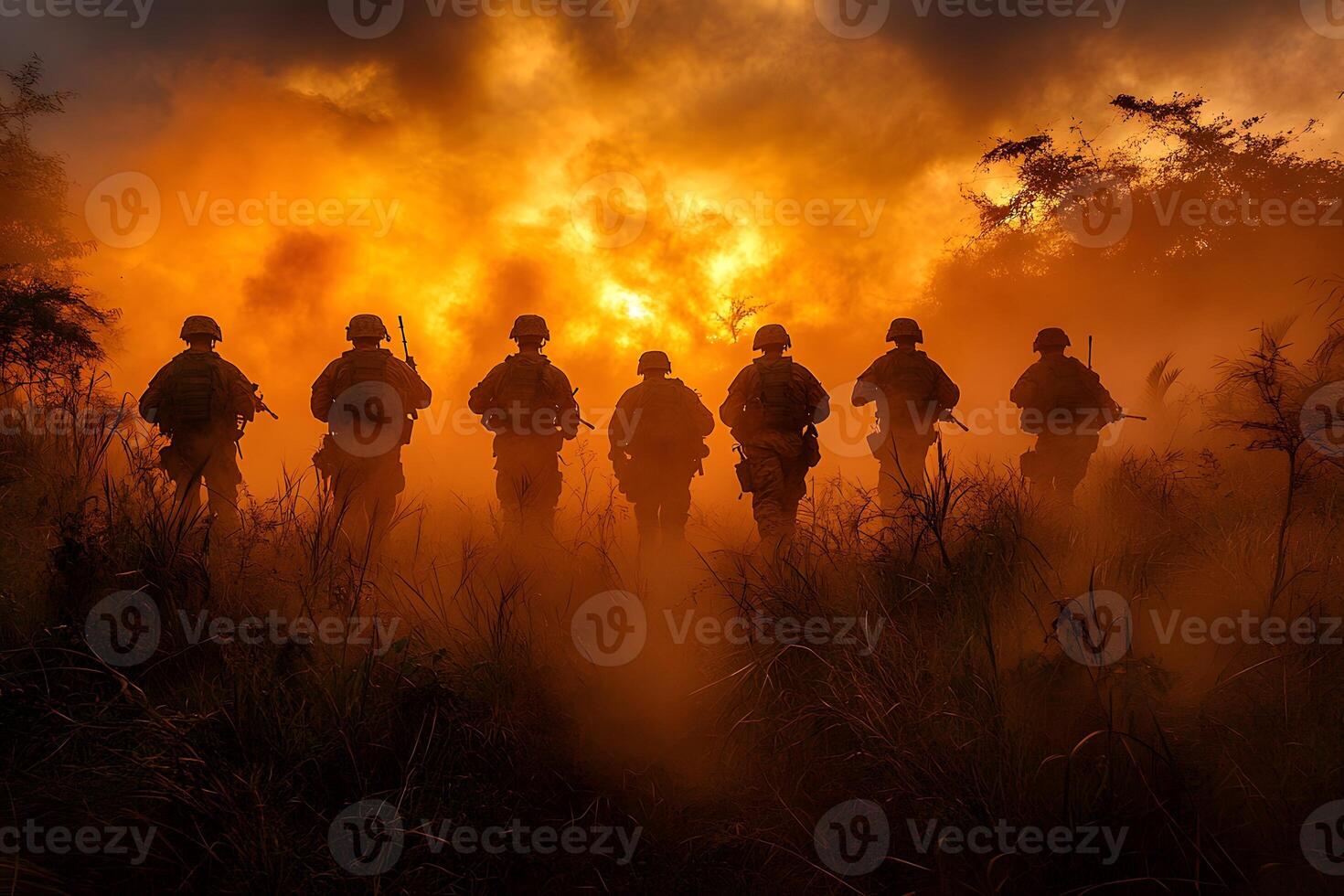 Tactical Military Team Marching at Sunrise in Smoky Terrain for Training Exercises photo