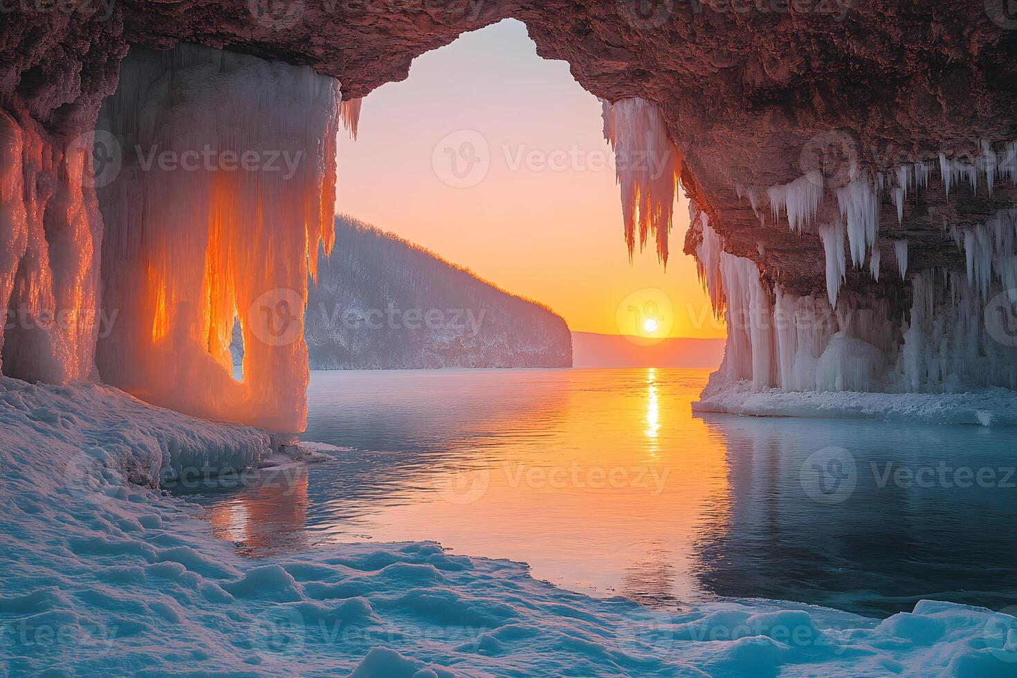 Breathtaking Winter Sunrise in Icicle-Covered Cave by Frozen Lake Shore photo