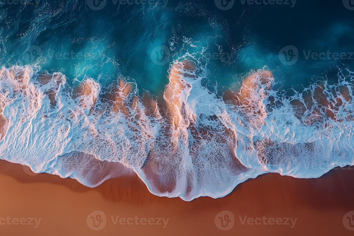 Aerial View of Ocean Waves Crashing on Sandy Beach at Sunset Perfect for Summer Vacation Themes and Travel Prints photo