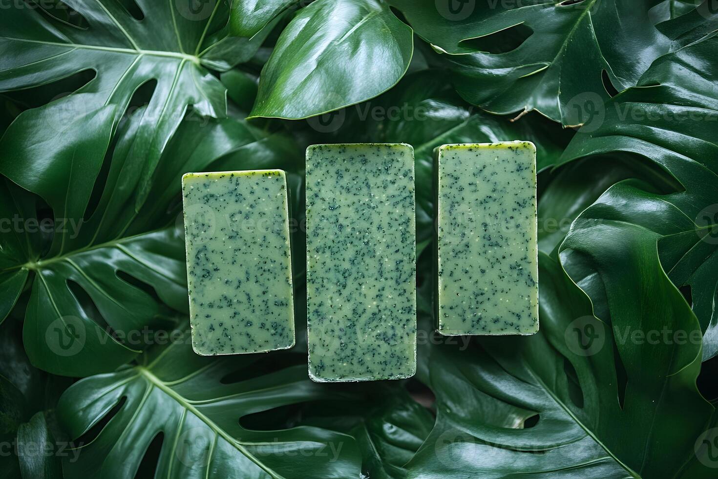 Natural Handmade Soap Bars on Tropical Monstera Leaves for Organic Skincare photo