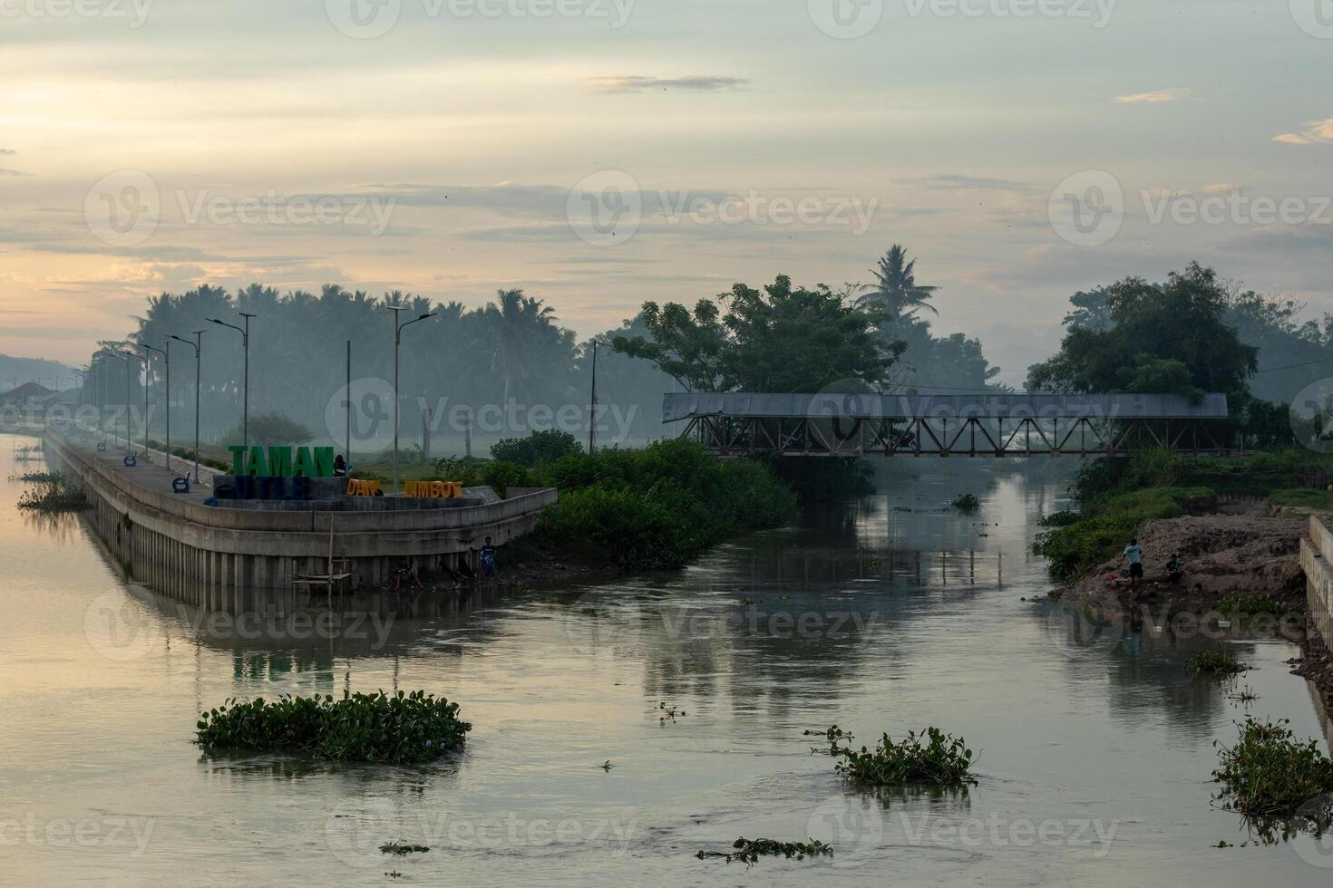 The bridge across the Gorontalo River in Tualango village, Indonesia photo