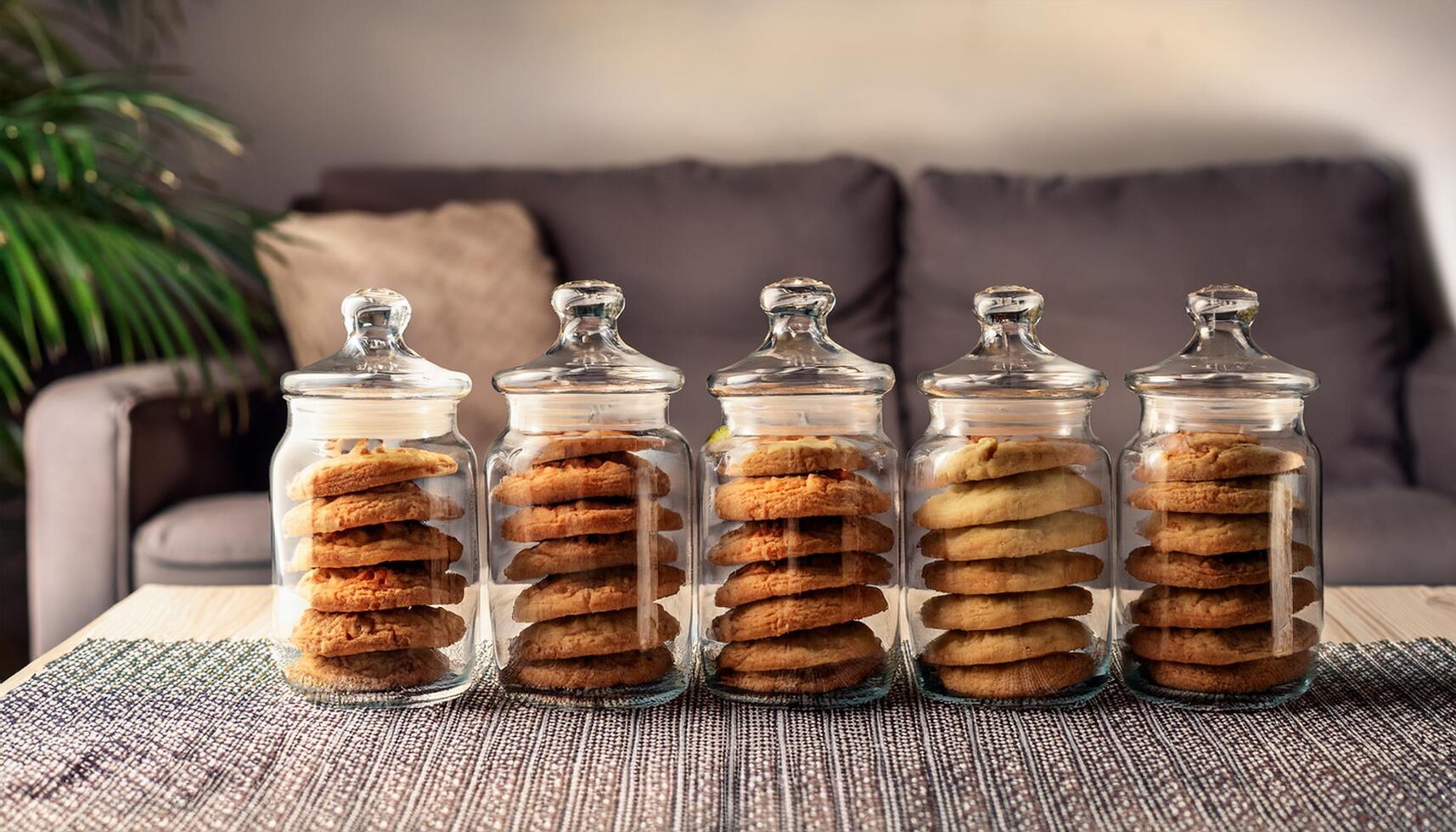 Cookie jar with cookies on table photo