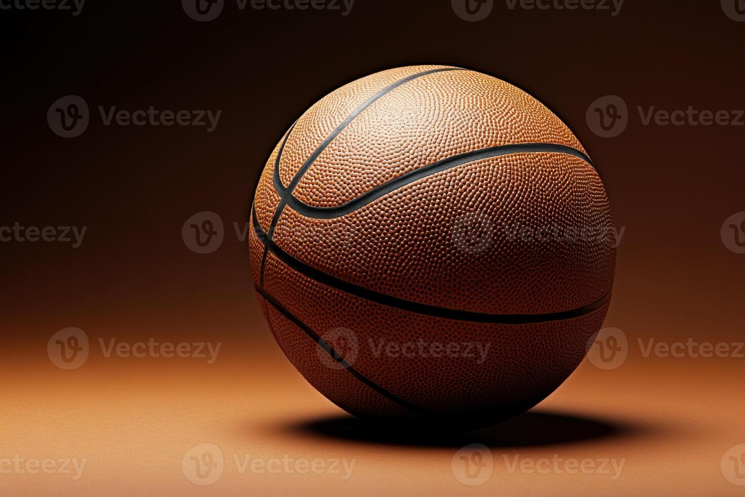Basketball resting on a surface with dramatic lighting showcasing its texture and design photo