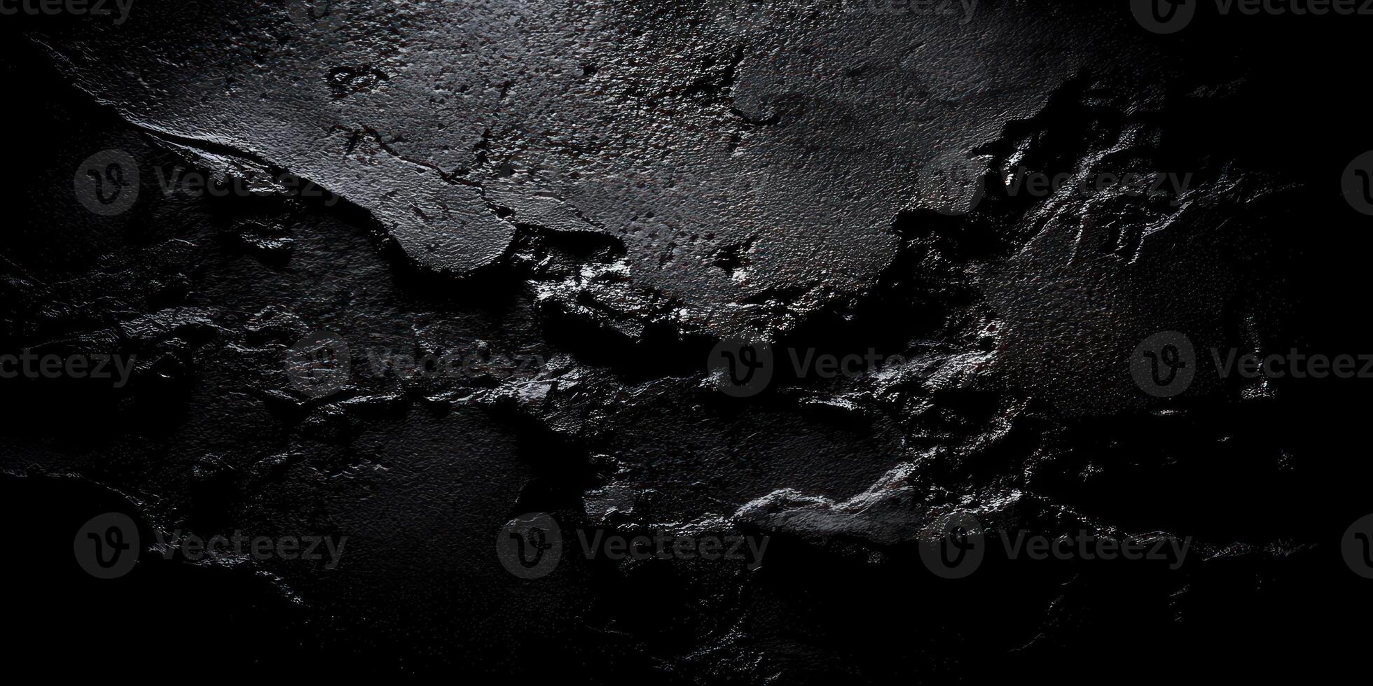 Textured matte black background with subtle directional lighting for modern design photo