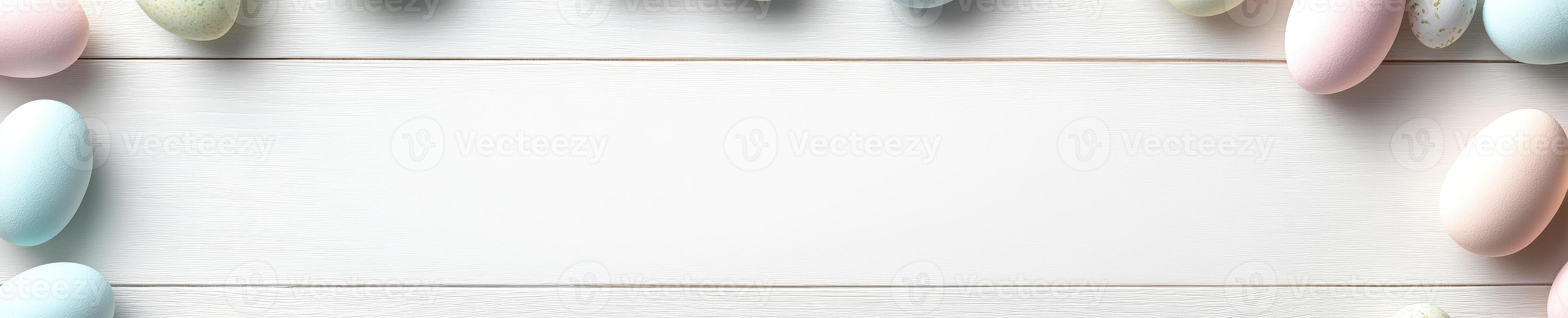 Pastel colored Easter eggs on white wooden background. Festive holiday design for greeting cards and decoration photo