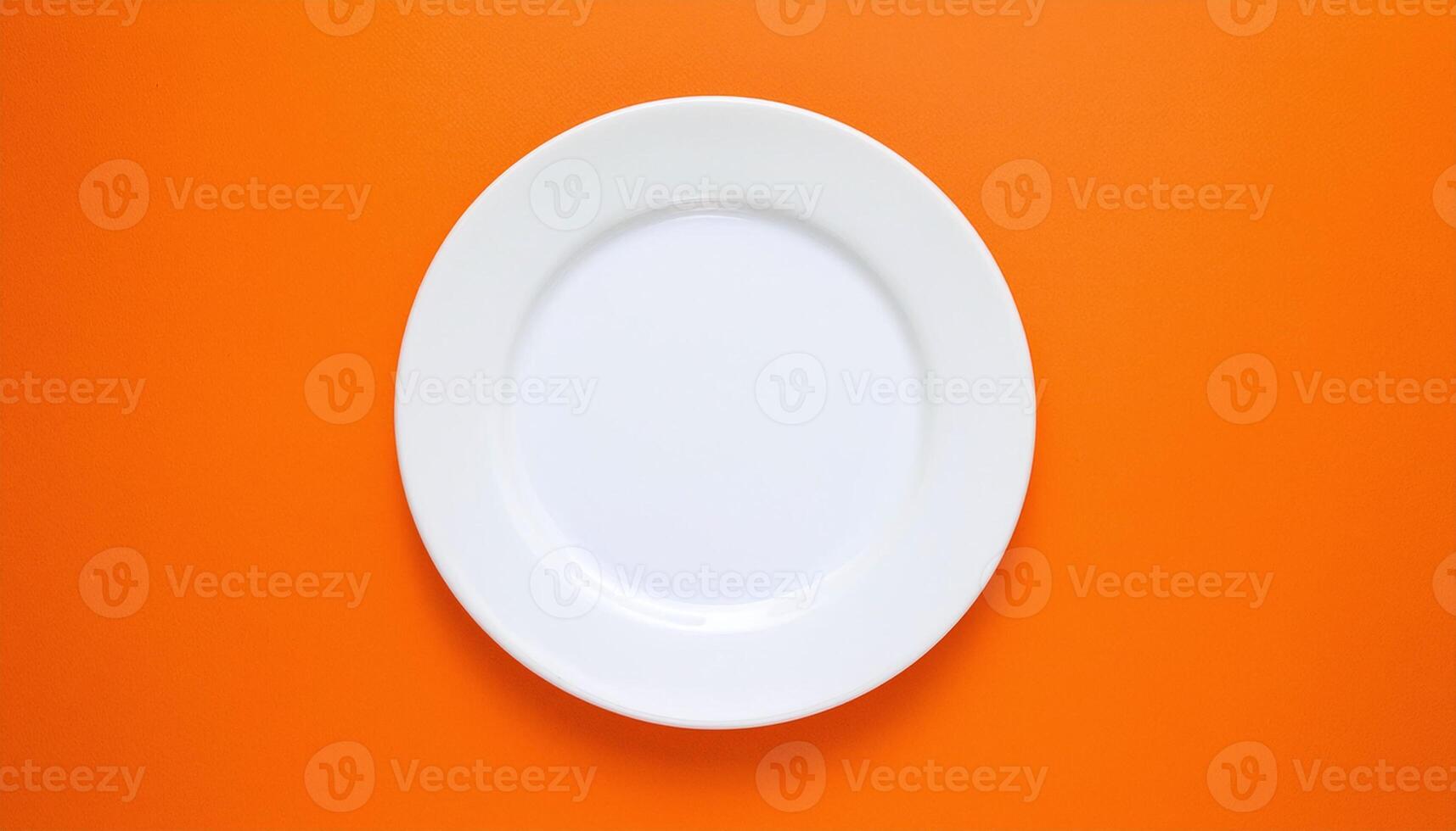 Classic White Plate on a Vibrant Orange Background photo
