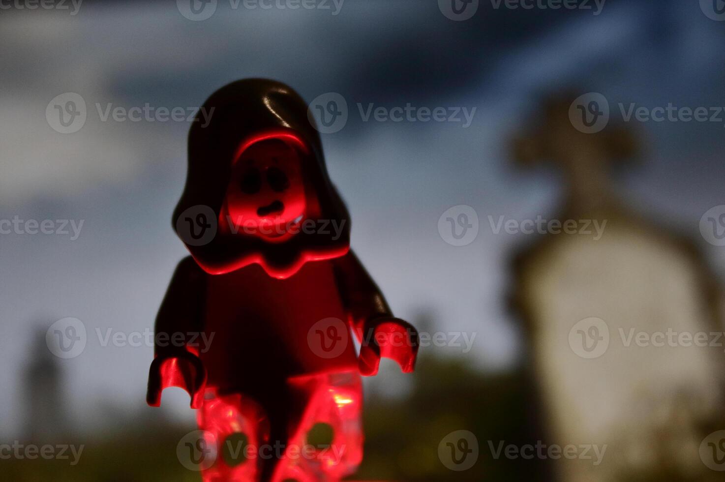 A phantom mini figure with a red hood on it photo