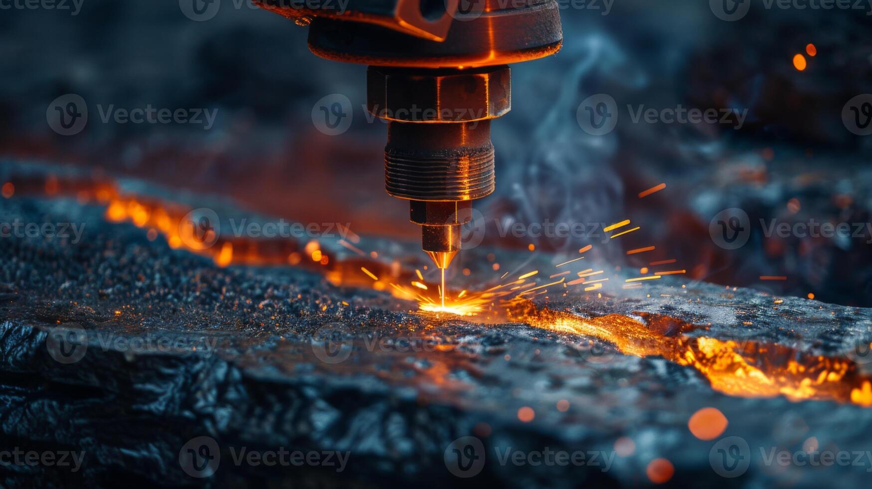 A laser cutter performs intricate cutting on a metallic surface, emitting bright sparks and a warm glow as it carefully carves through the material in a workshop at dusk. photo