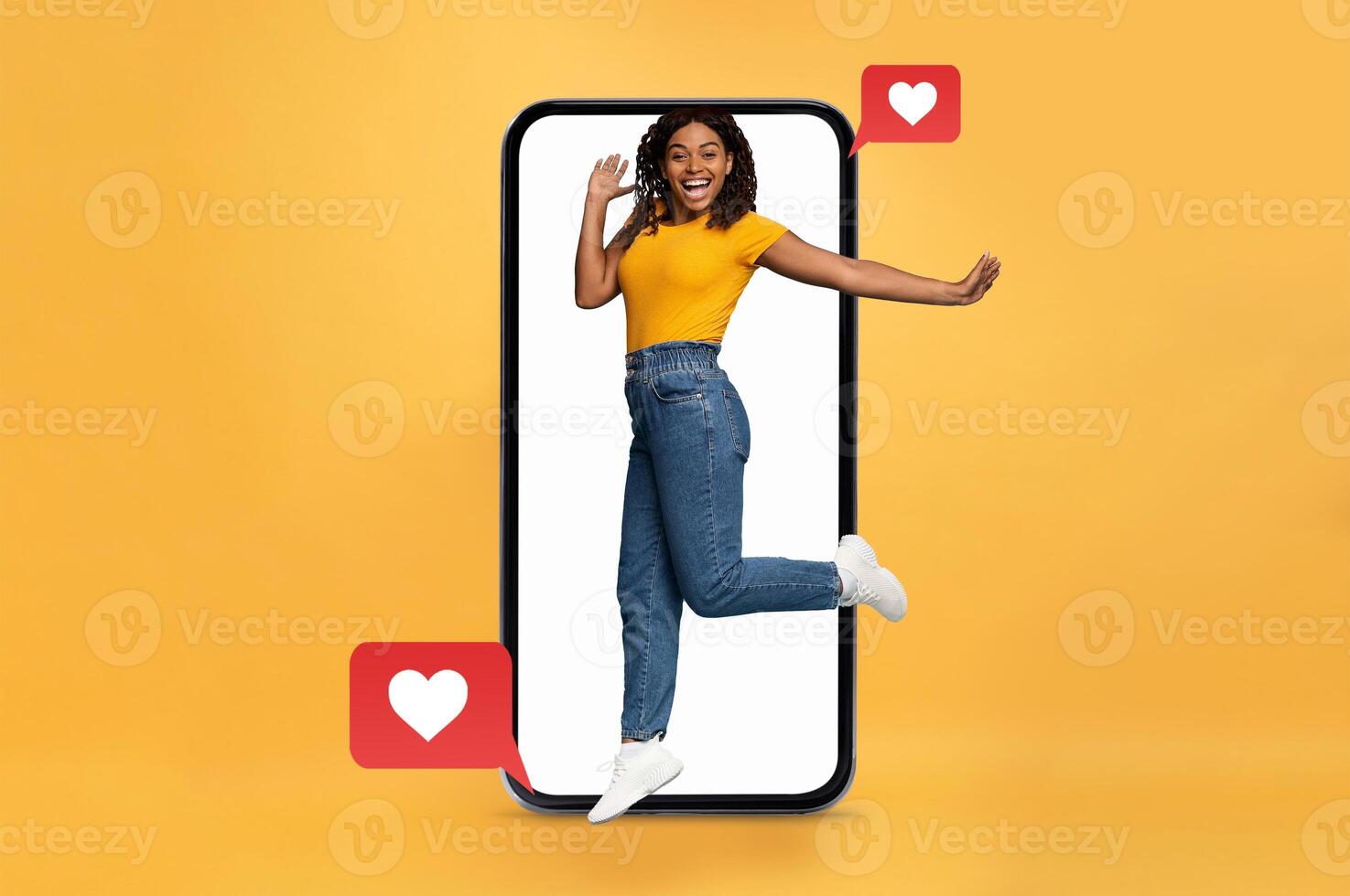 A young woman joyfully interacts with her smartphone, symbolizing the excitement of online communication. Heart icons express her happiness, highlighting modern dating and social media engagement. photo