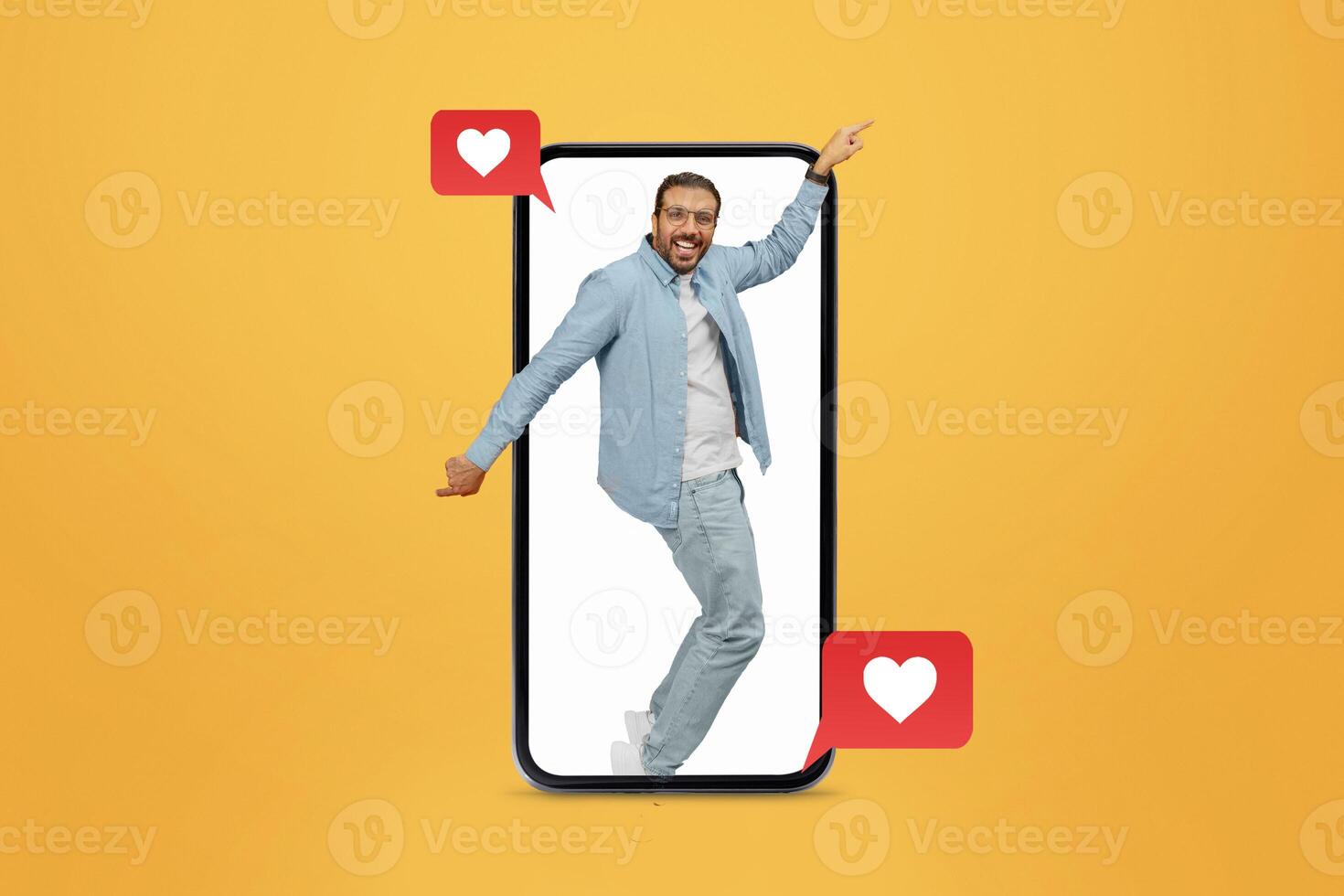 A person stands excitedly inside a large smartphone, engaging with love-themed messages. The bright yellow background enhances the playful vibe of modern dating and connection. photo