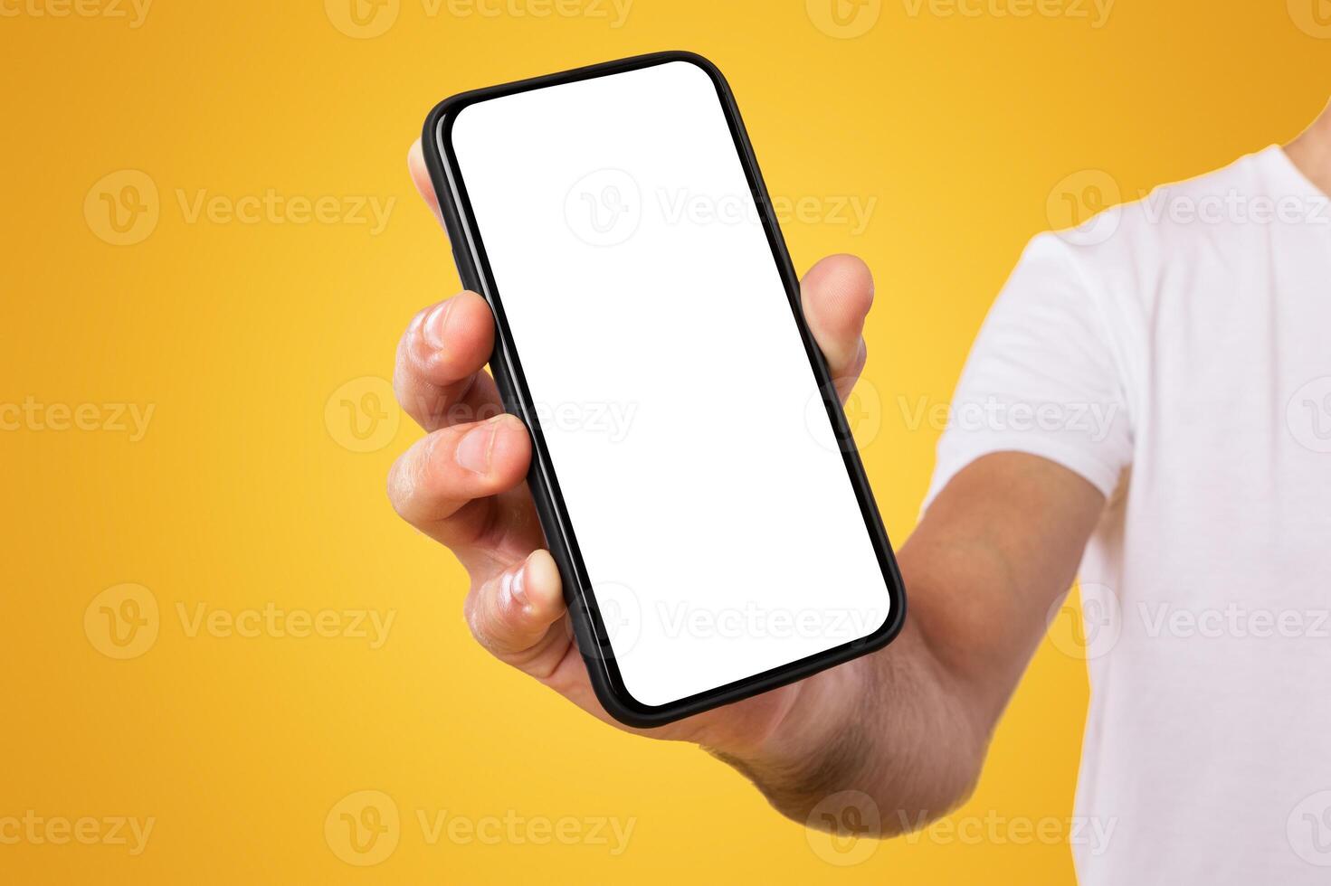 Mobile Application Ad. Close Up Of Man Showing Smart Phone Empty Screen Recommending App Standing On Yellow Orange Studio Background. Isolated Transparent Cellphone Display Mock Up, Check This Website photo