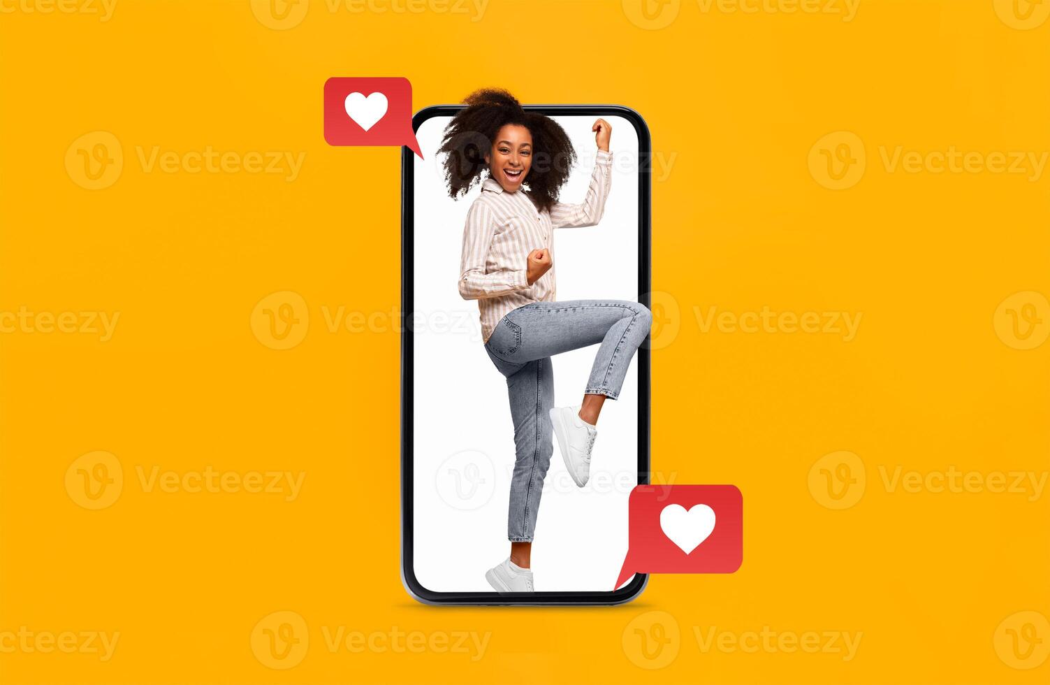 A joyful person is seen inside a smartphone, expressing happiness and excitement. The setting highlights themes of love and connection, perfect for Valentine's Day. photo