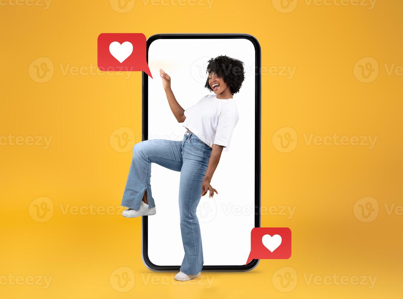 A person joyfully interacts with a smartphone, smiling while engaging with heart-themed social media messages. photo