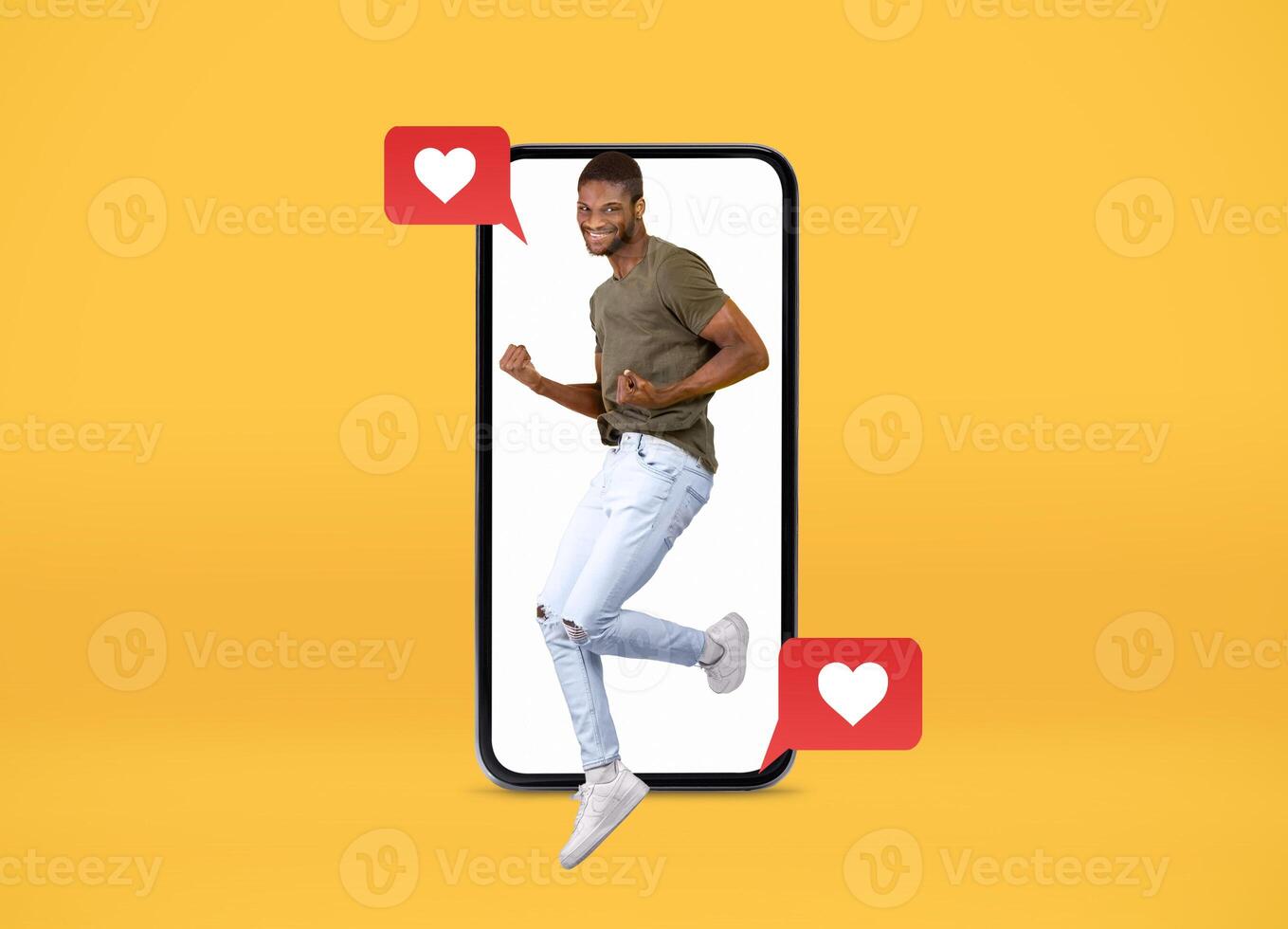 A young man is joyfully leaping out of a smartphone screen, showing excitement for connections. With playful heart icons, this vibrant collage highlights modern dating and social interactions. photo