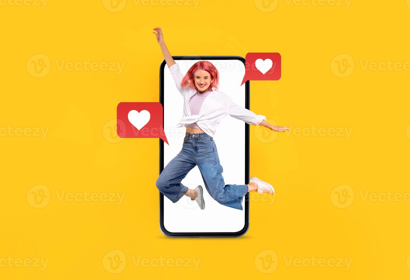 A joyful person jumps in front of a large smartphone displaying heart icons, symbolizing love and communication. The vibrant yellow background enhances the lively atmosphere of modern dating. photo
