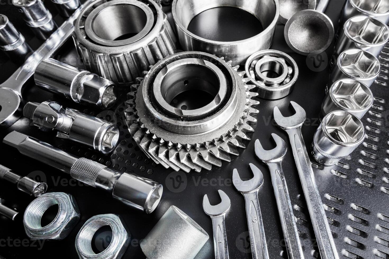 Metal tools arranged neatly on a workbench highlighting their features and functionality for various mechanical tasks photo