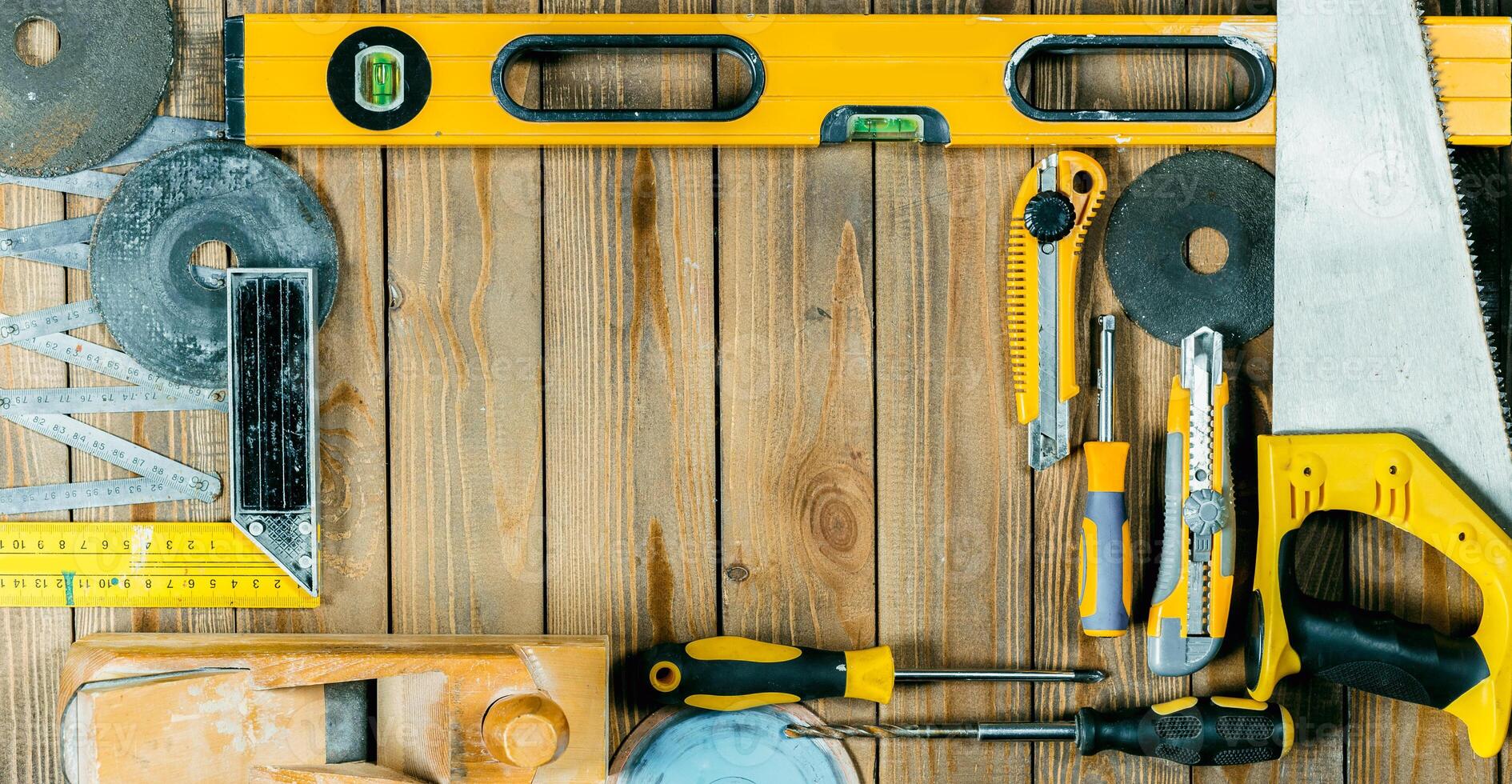 Tools arranged neatly on a wooden surface ready for a construction or DIY project at home photo
