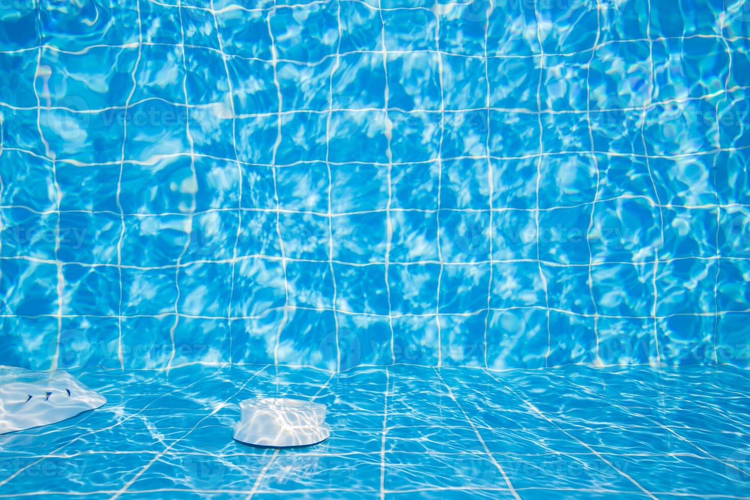 Refreshing blue swimming pool with rippling water and calm atmosphere during sunny day photo