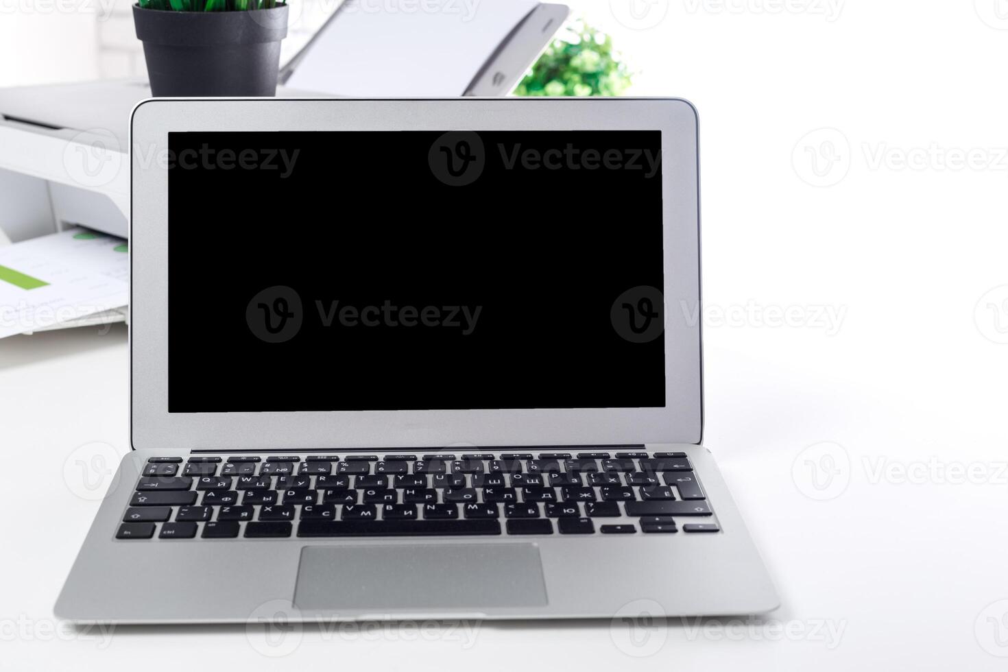 Modern laptop placed on a clean workspace with minimal decor and focus on technology photo