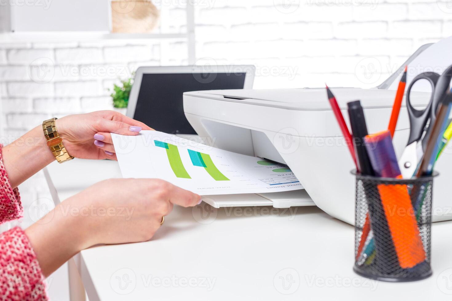 Printing a colorful document on a modern printer in a bright office space photo