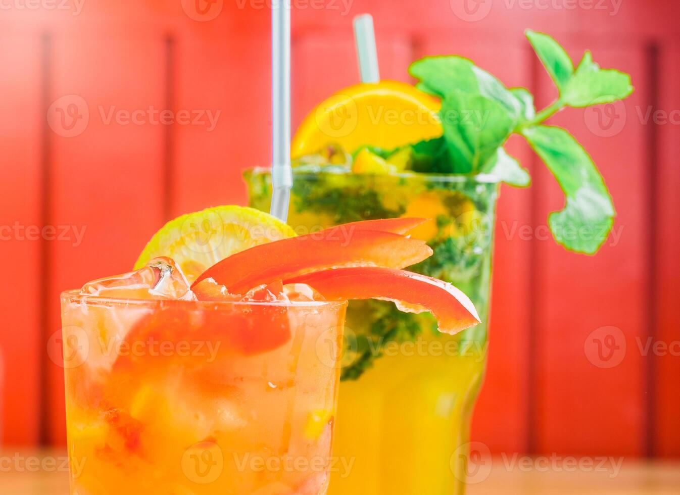 Colorful cocktails with fresh garnishes served at a vibrant setting during a summer gathering photo