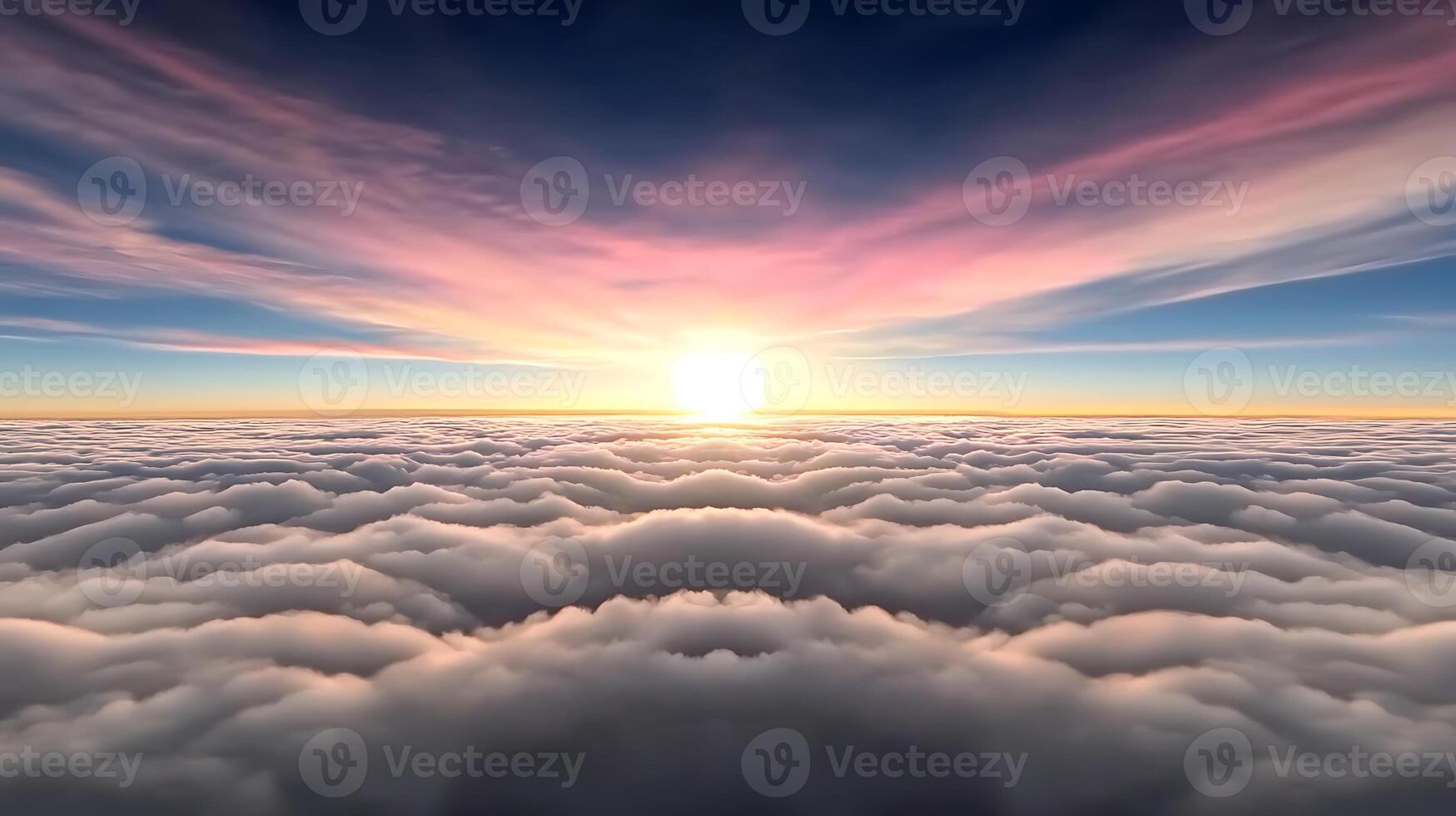 A breathtaking sunrise above a sea of clouds, illuminating the sky with vibrant colors photo