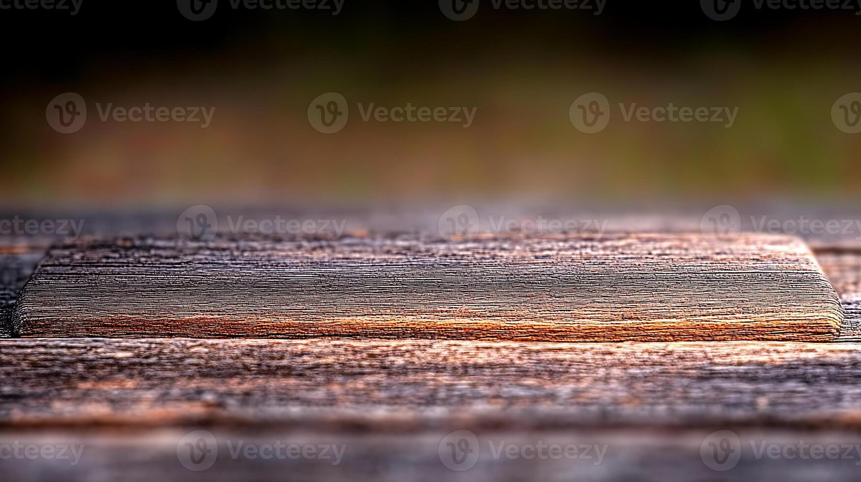 A close-up of a wooden plank resting on a rustic table, with a blurred natural background photo