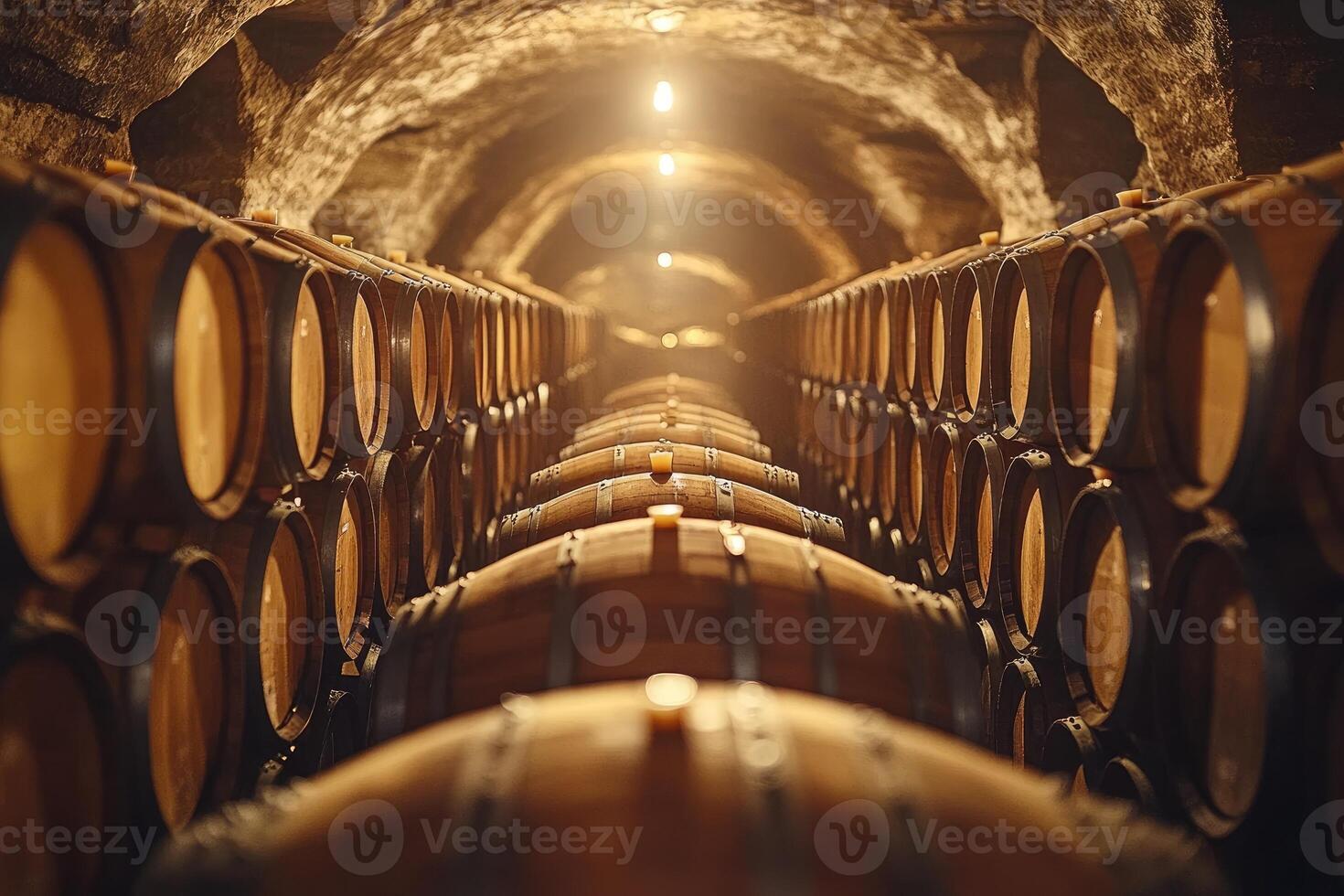 Wine barrels stacked inside a cellar forming a tunnel perspective photo