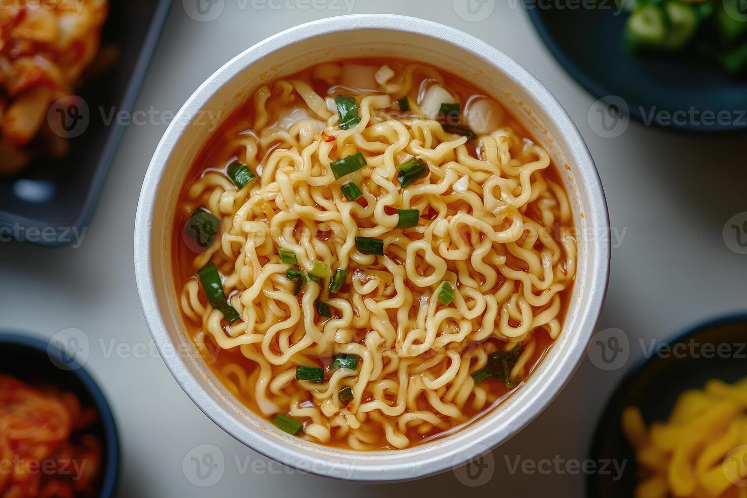 Delicious instant noodles with green onions in bowl photo