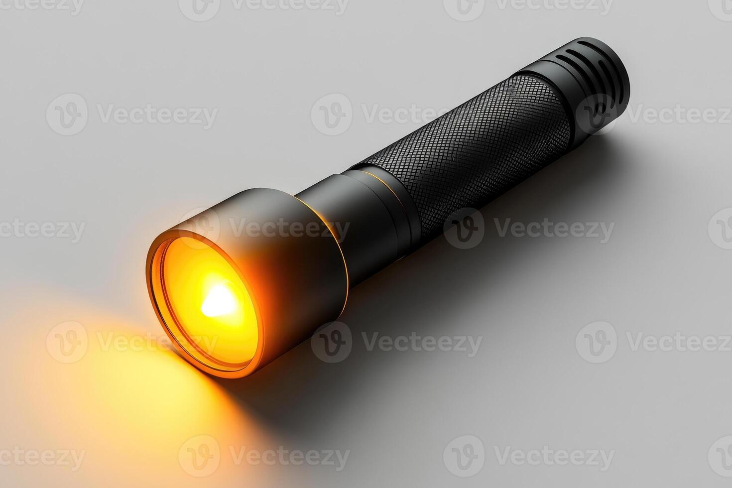 Illuminated flashlight casting warm orange glow photo