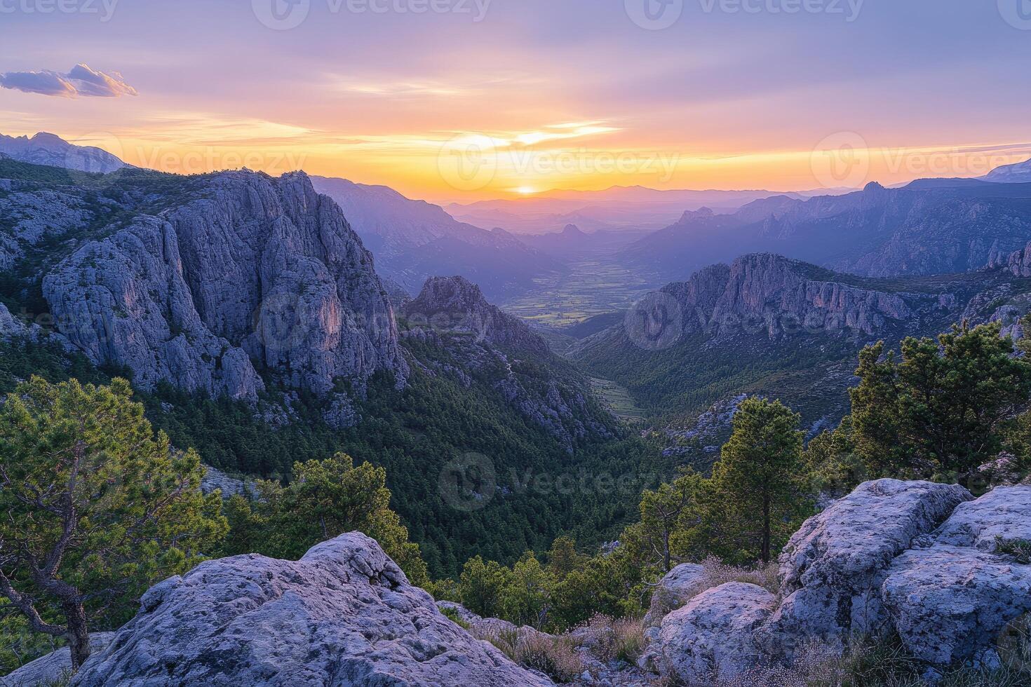 Majestic sunset over rocky mountain valley photo