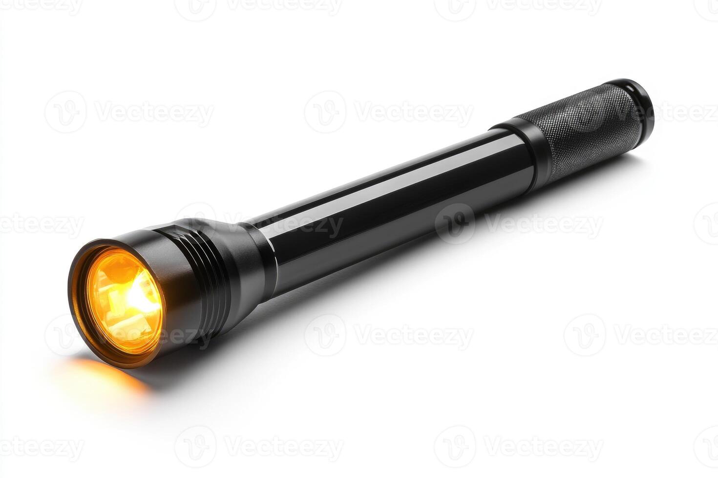 Illuminated flashlight casting warm orange glow. photo