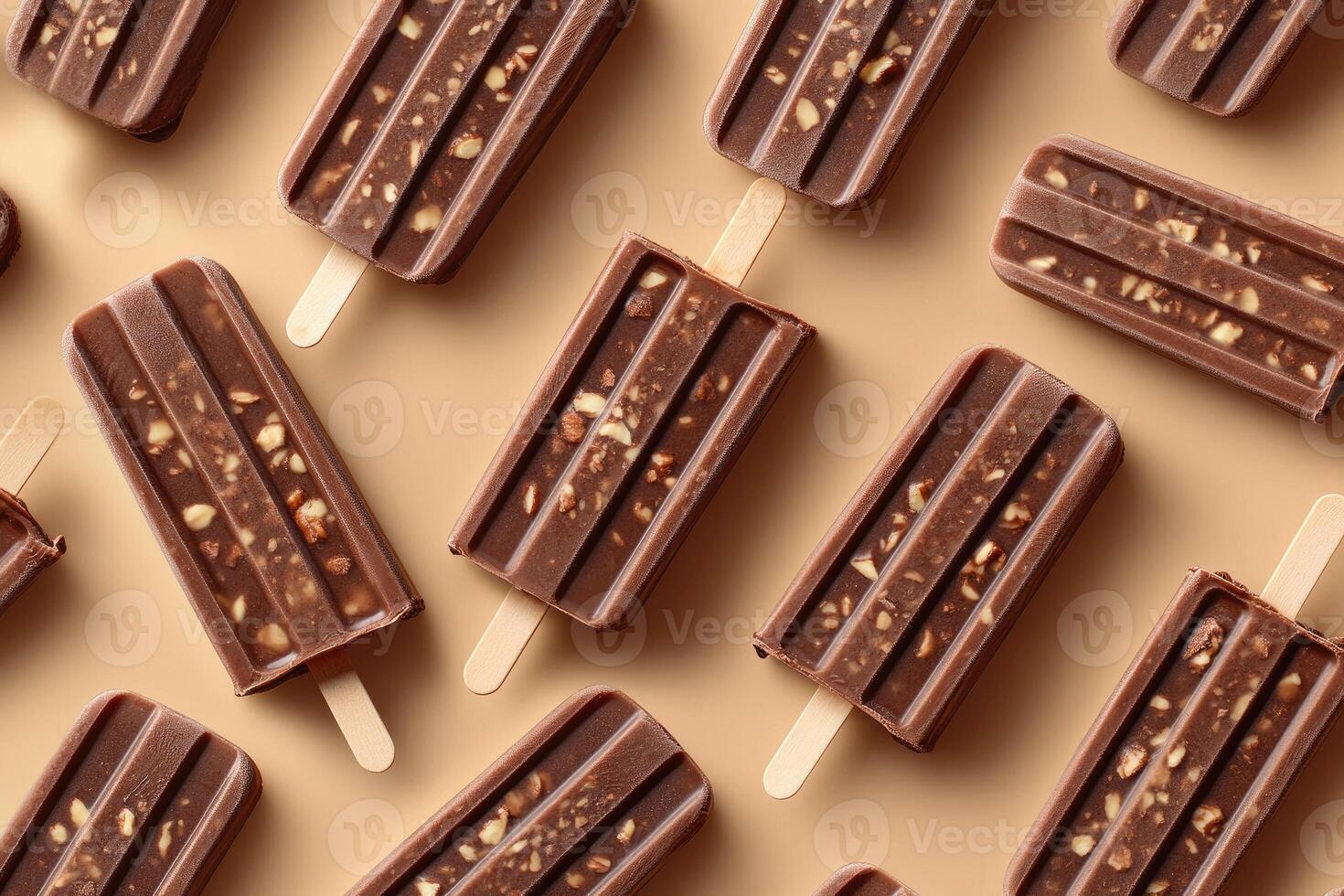 Chocolate ice cream popsicles with nuts forming a pattern on beige background photo