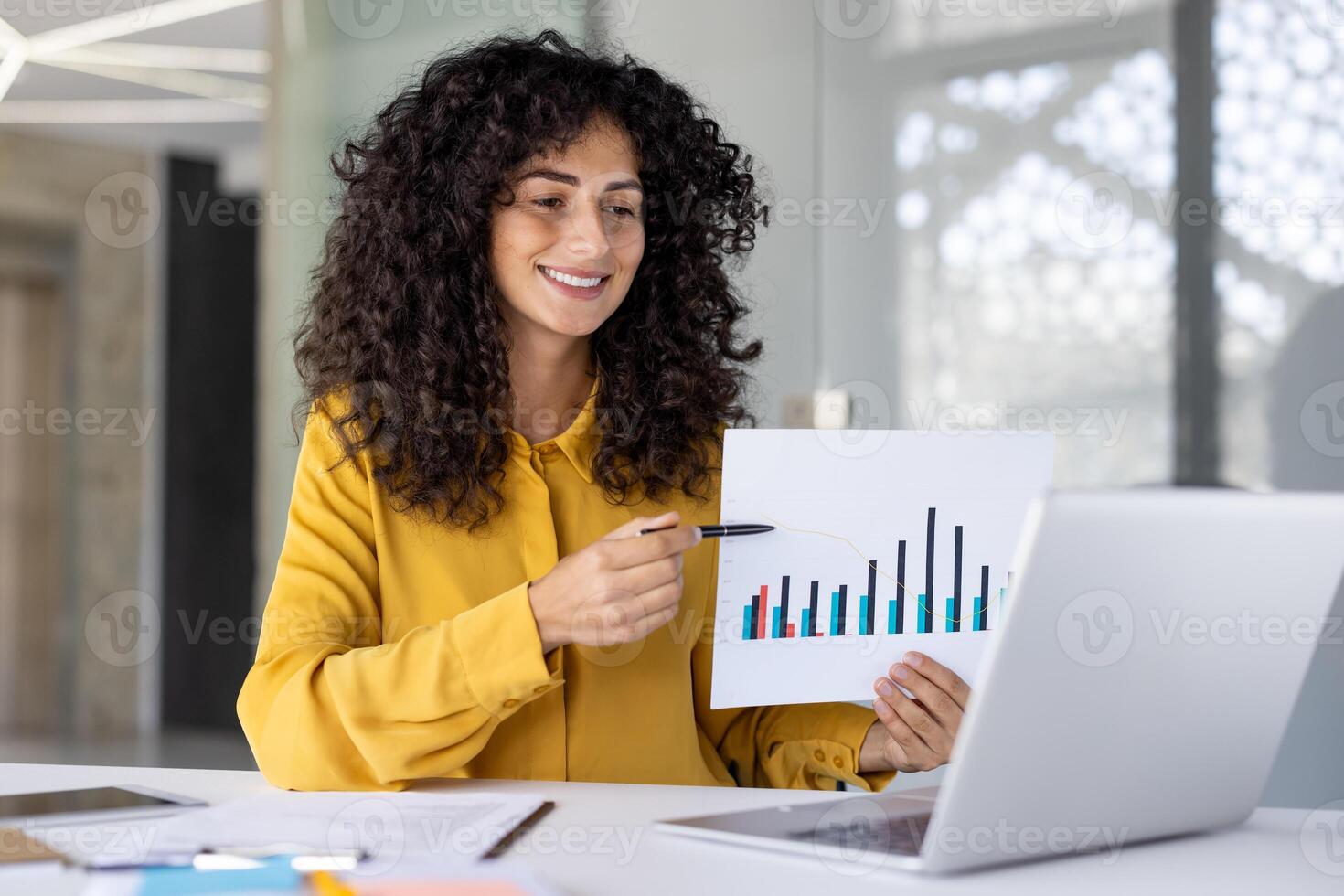 Online business presentation conference. Woman happily smiling showing sharing financial investment report, graph with charts. Businesswoman at workplace using notebook for call. photo