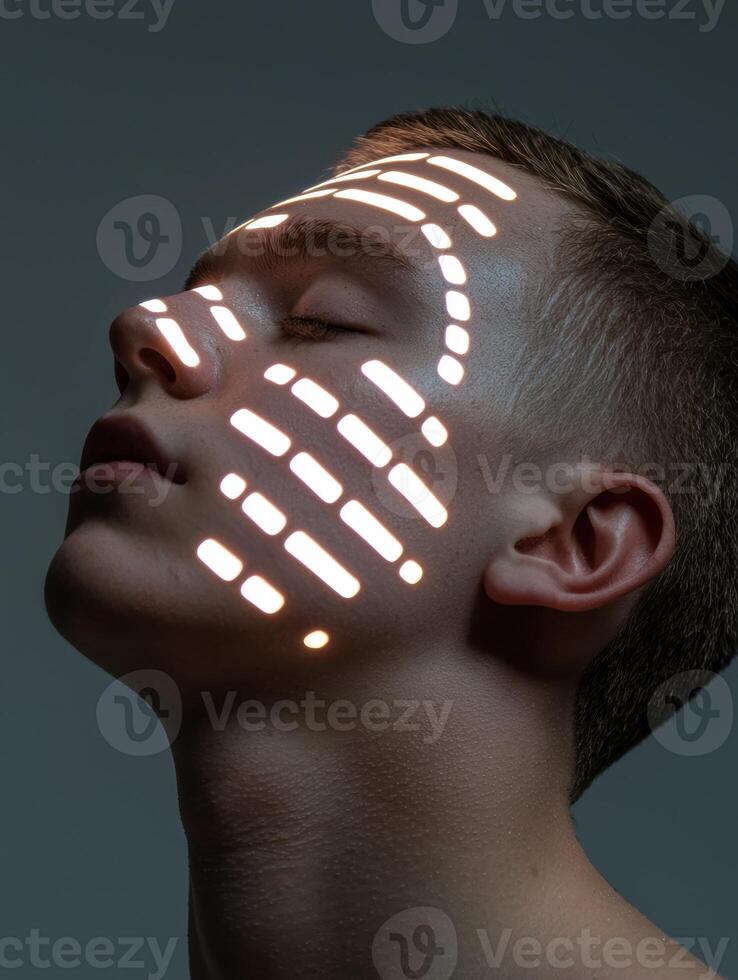 A man with light patterns on his face photo