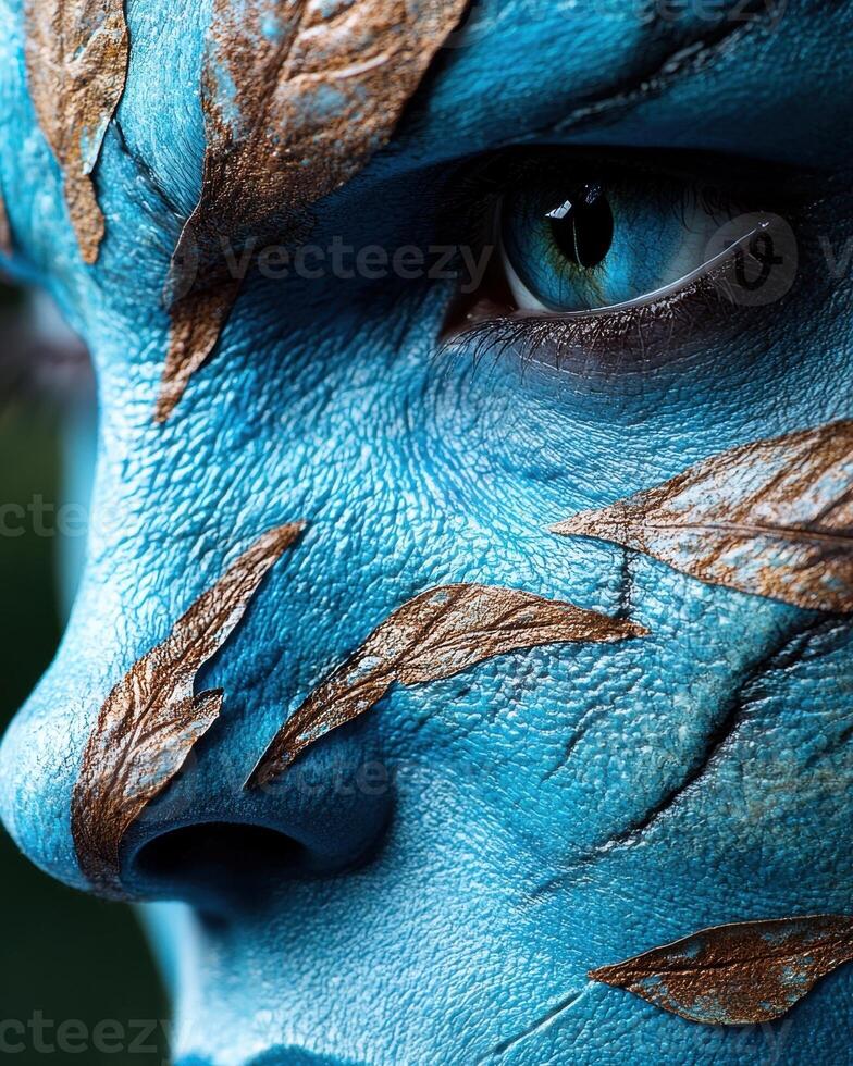 Close up of a blue humanoid face with leaf like markings photo