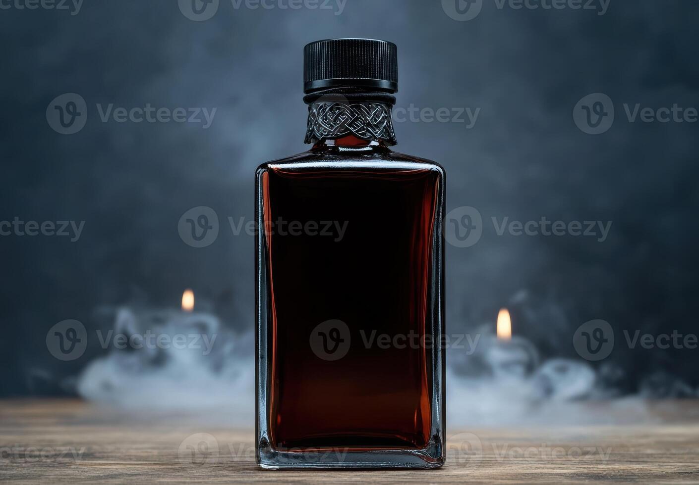 A bottle of dark liquor on a wooden surface with a smoky background photo