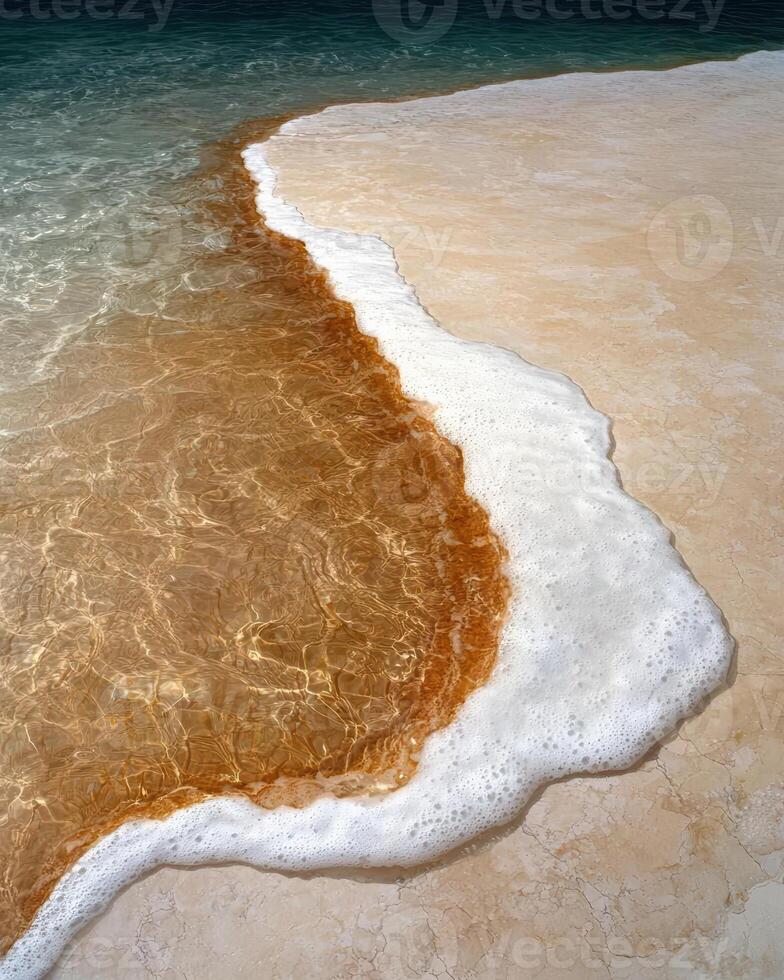 Foamy water meets a sandy shore photo