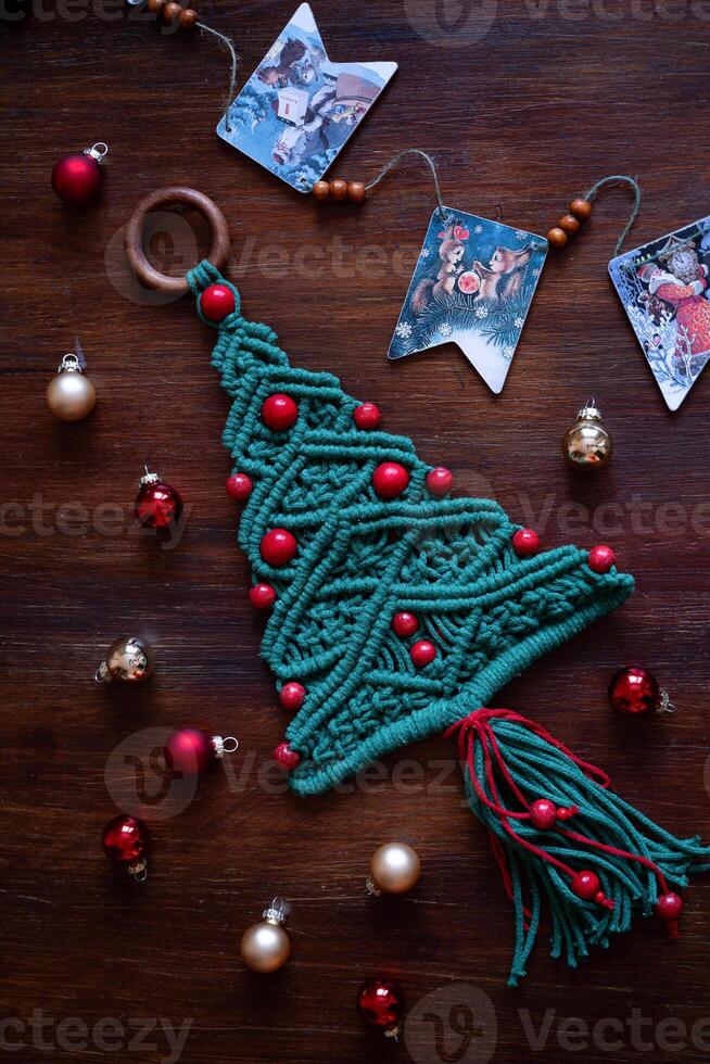 Christmas decoration macrame tree on the table top view photo