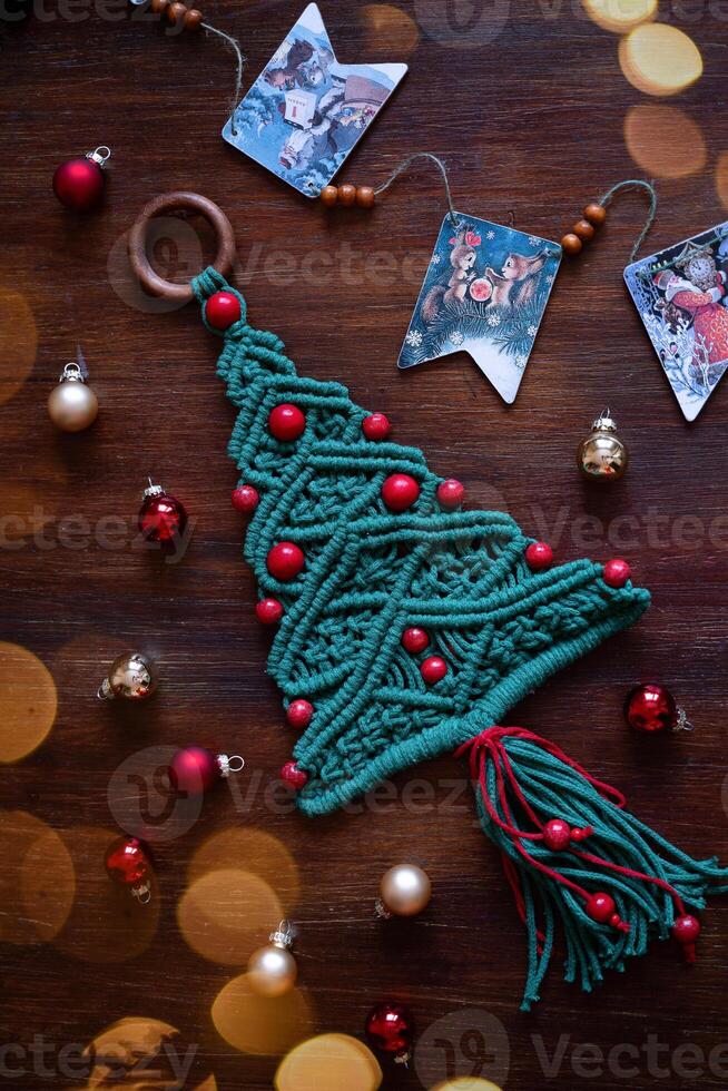 Christmas decoration macrame tree on the table top view photo